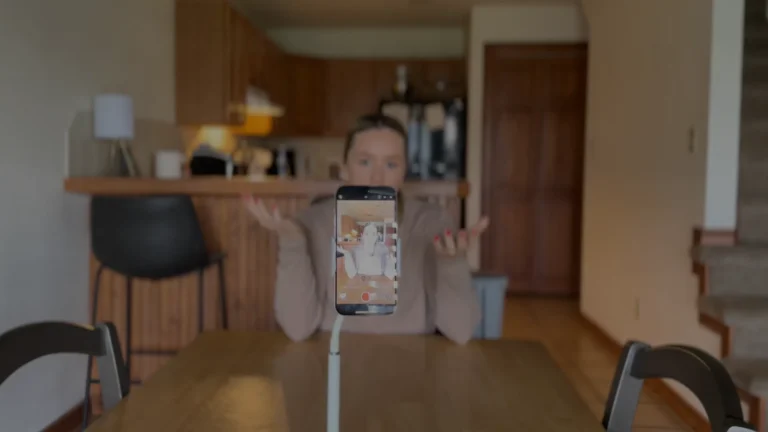 Savannah Abney, founder of The Breezy Company, working at her desk, illustrating the benefits of a founder personal brand in a professional setting.